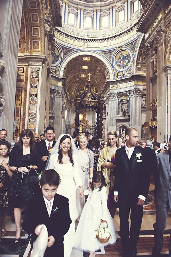 newlywed walking amidst friends and family - wedding photo by top Rome based destination wedding photographer Rochelle Cheever, Rome Weddings Photography